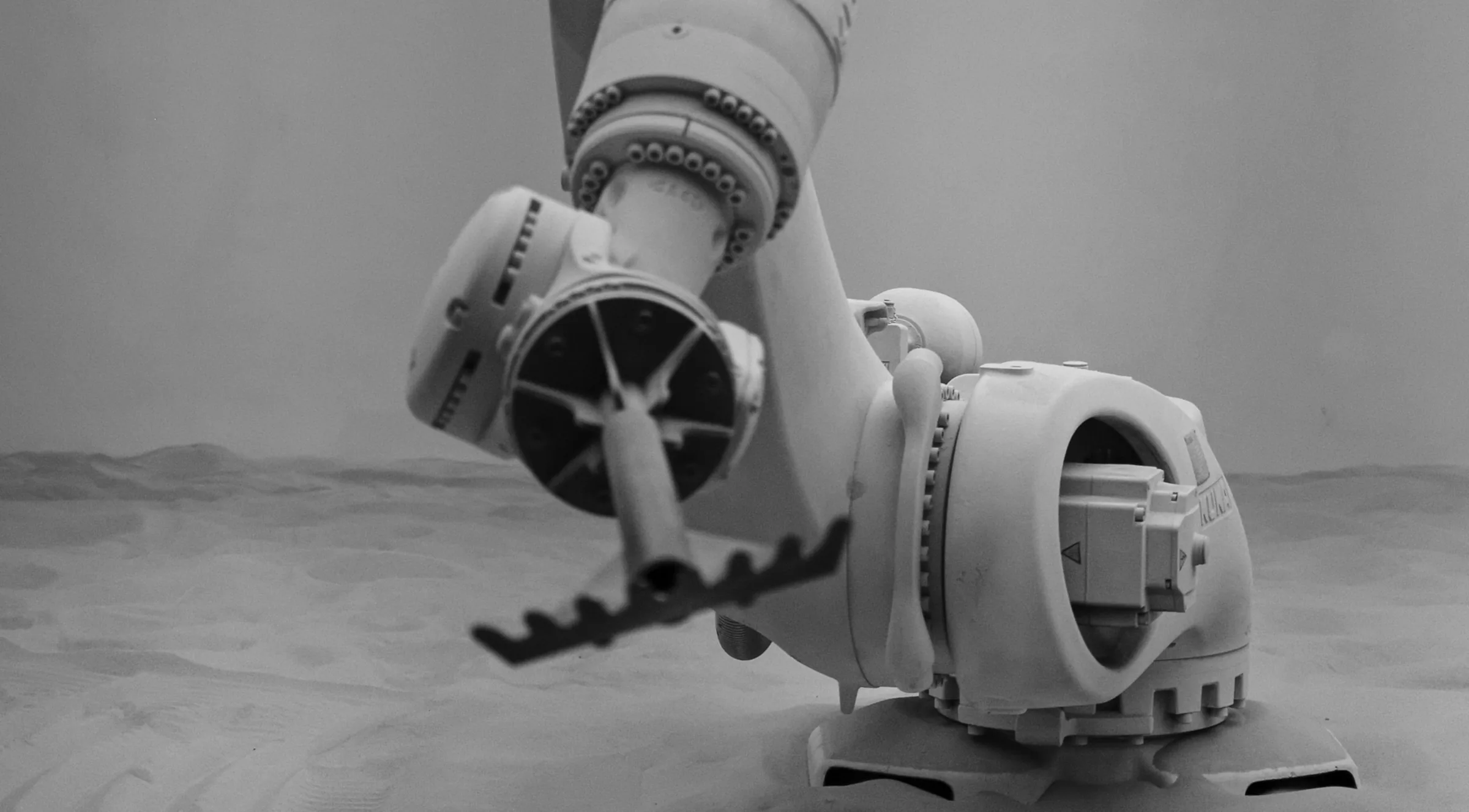 An industrial robotic arm with a gripper attachment